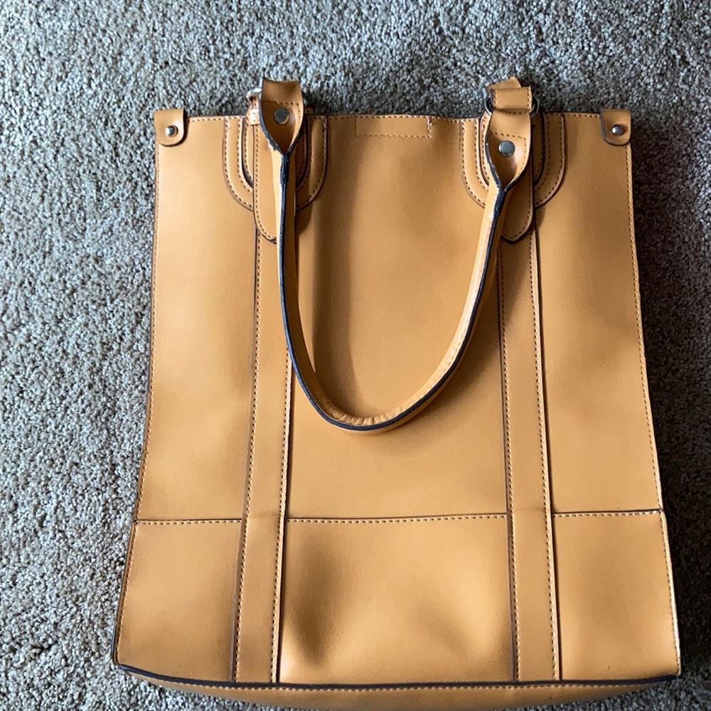Emillie M. Purse,buckle to close.Mini pouch inside